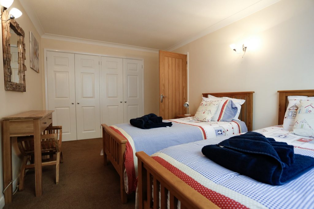 Twin bedroom, 2 single beds with cupboard space at the back of the room